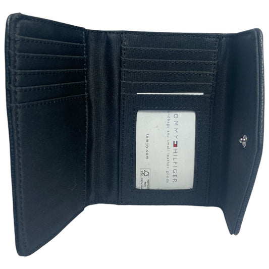 Open black wallet with visible brand label for the details