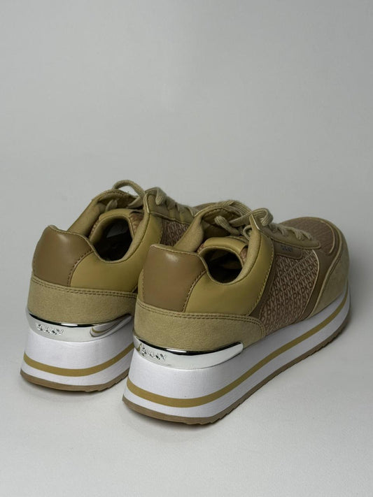 DKNY monogram wedge sneakers in a tan/beige color.