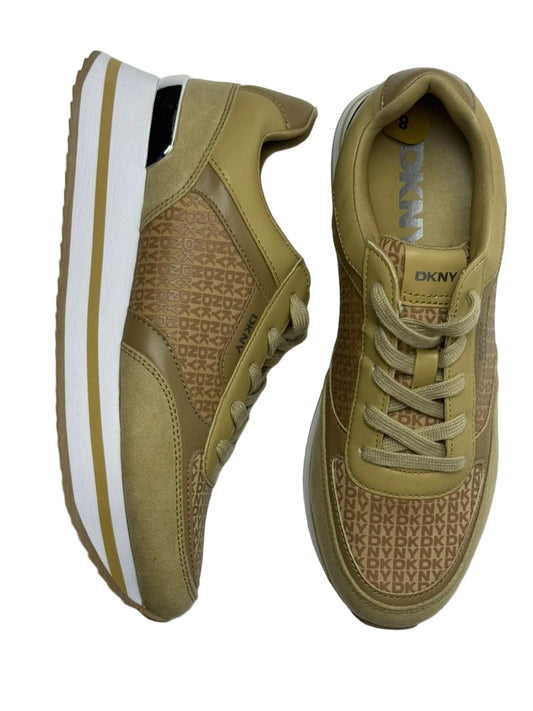 DKNY monogram wedge sneakers in a tan/beige color.