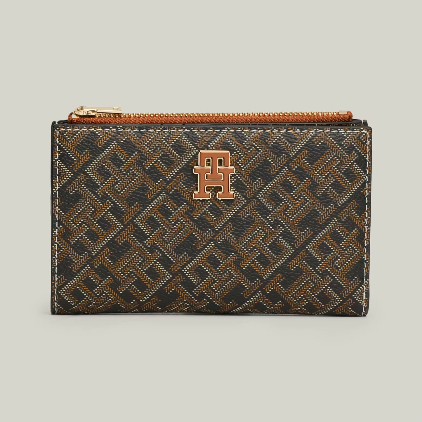 TH Patterned wallet with a logo on it