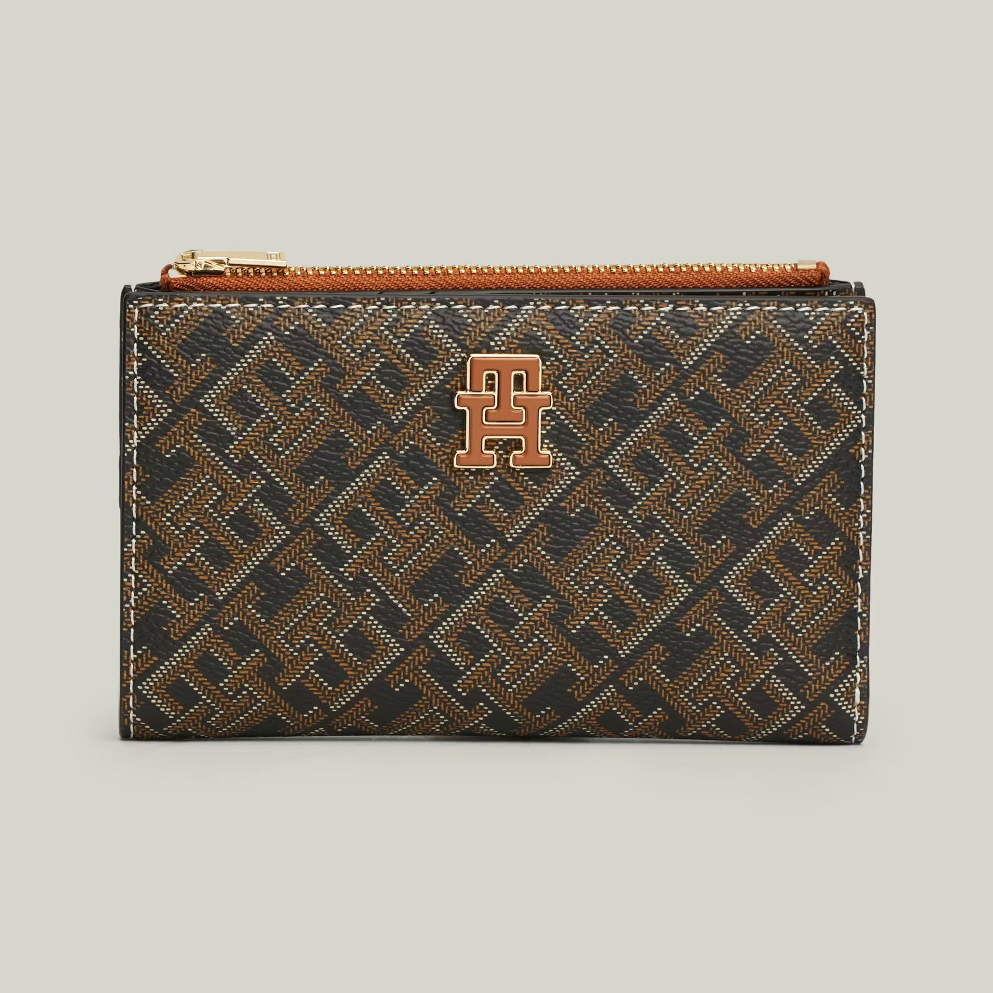TH Patterned wallet with a logo on it