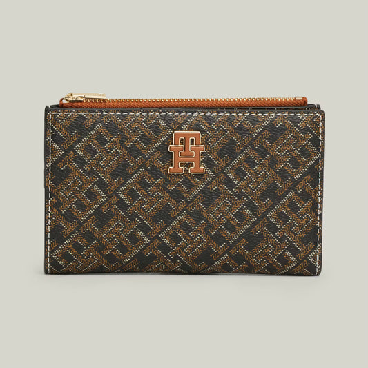 TH Patterned wallet with a logo on it